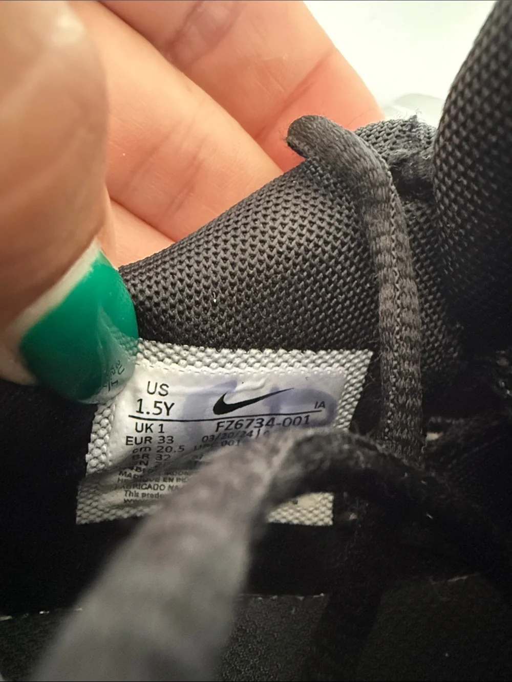 Nike Black Sneakers with White Swoosh Accent